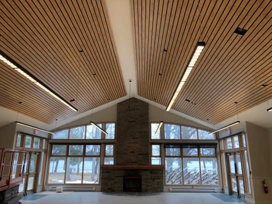A photograph of the renovated ceilings in the dining hall and lounge with new sound panels.