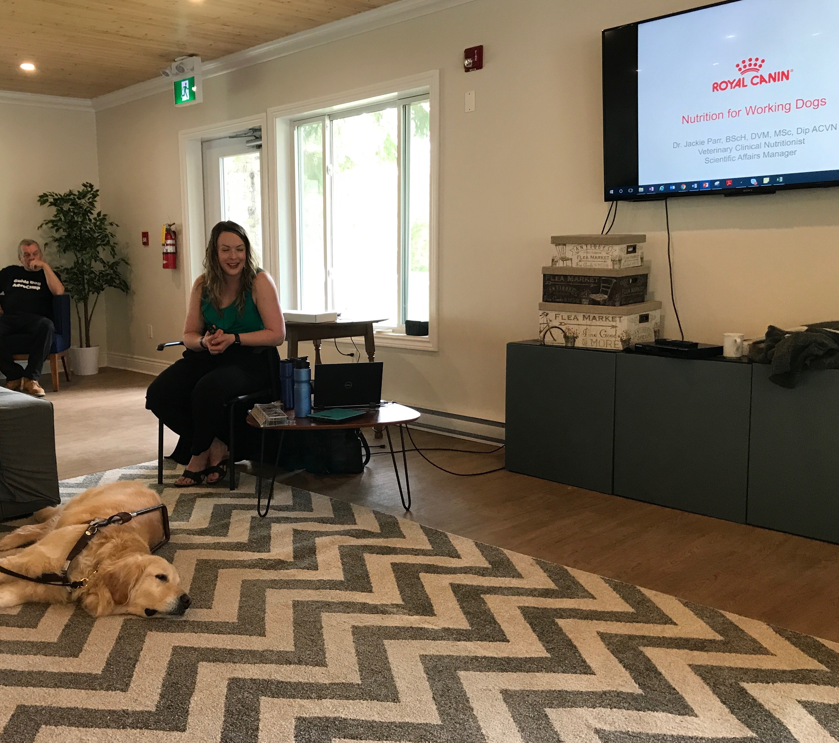  Dr. Parr sits down and chats with guide dog handlers at the Recreation Centre at CNIB Lake Joe.