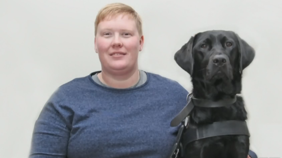 Ashley and her guide dog, Danson, at their 2018 guide dog graduation ceremony.