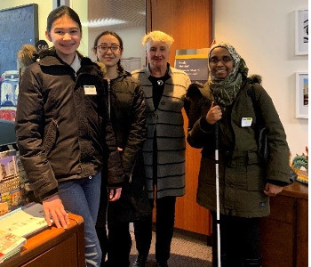 Ward 14 Toronto-Danforth Councillor Paula Fletcher with students Dalia Golovco and Maddie Dick, and Ramla Abukar, Coordinator, Advocacy and Engagement, CNIB posing for a photo.