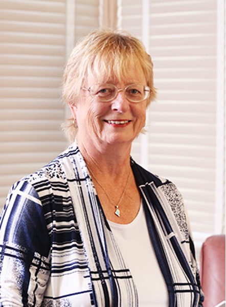 Susan Creasy smiles for a photograph.