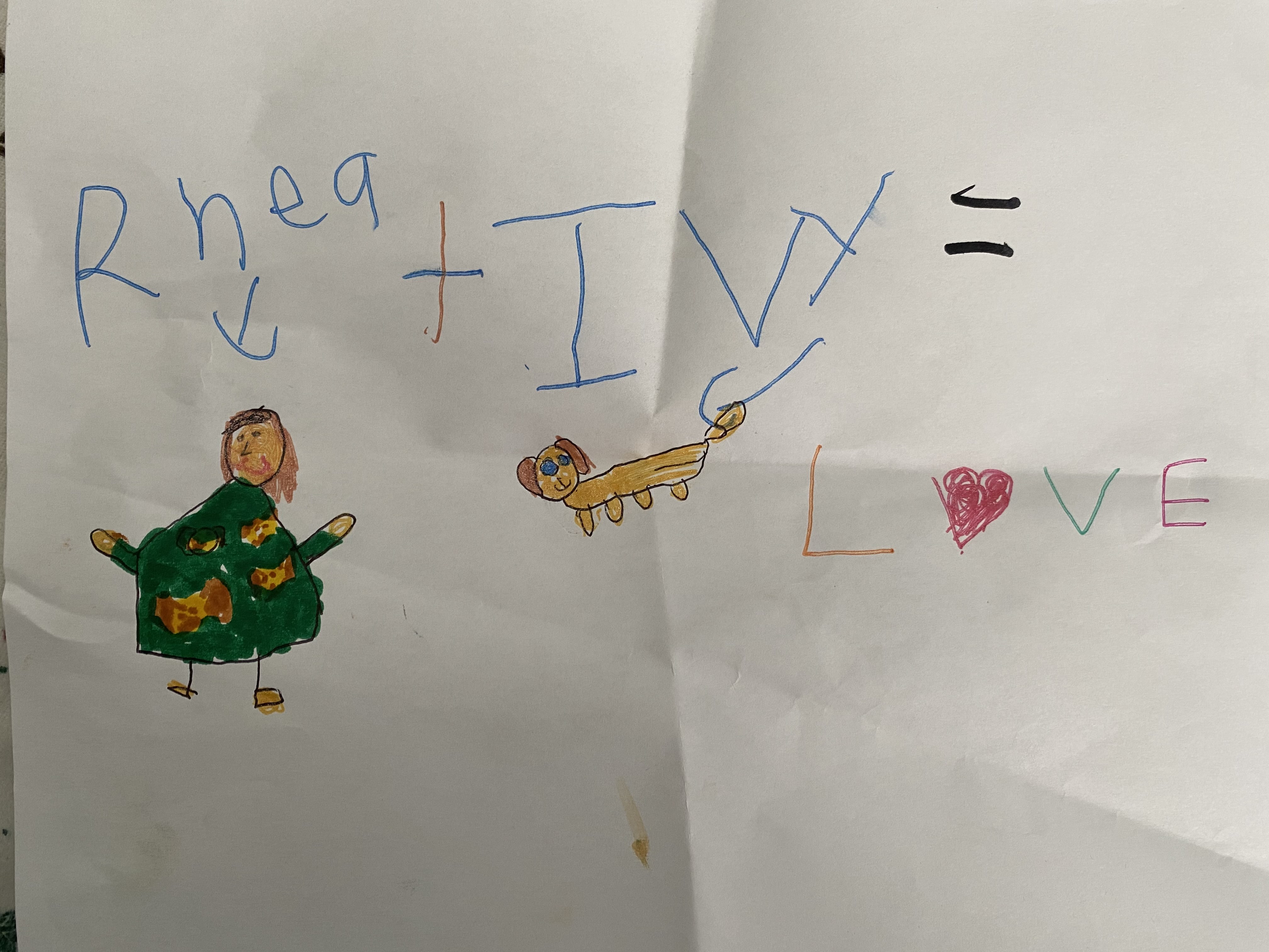 Un dessin que Rhea a fait d'elle-même et d'Ivy avec les mots « Rhea + Ivy = Love (amour) ».