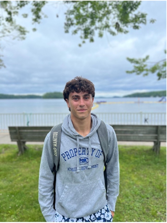Zachary Levin smiles as he stands in front of the Lake Joe waterfront.