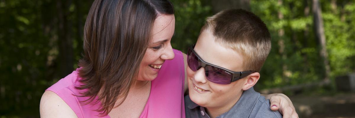 Boy and mother smiling 