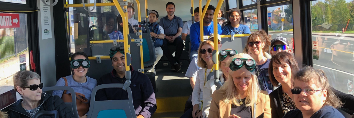 Moncton residents sitting on a bus as part of CNIB’s Get on Board Campaign. 