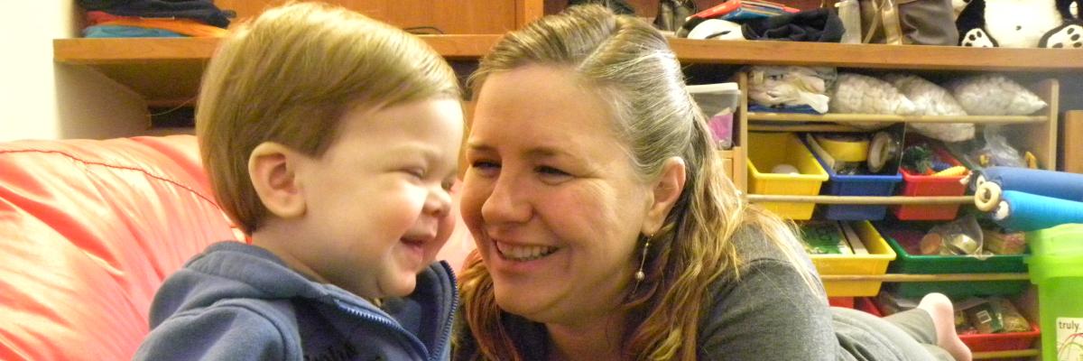 Boy and mother smiling 