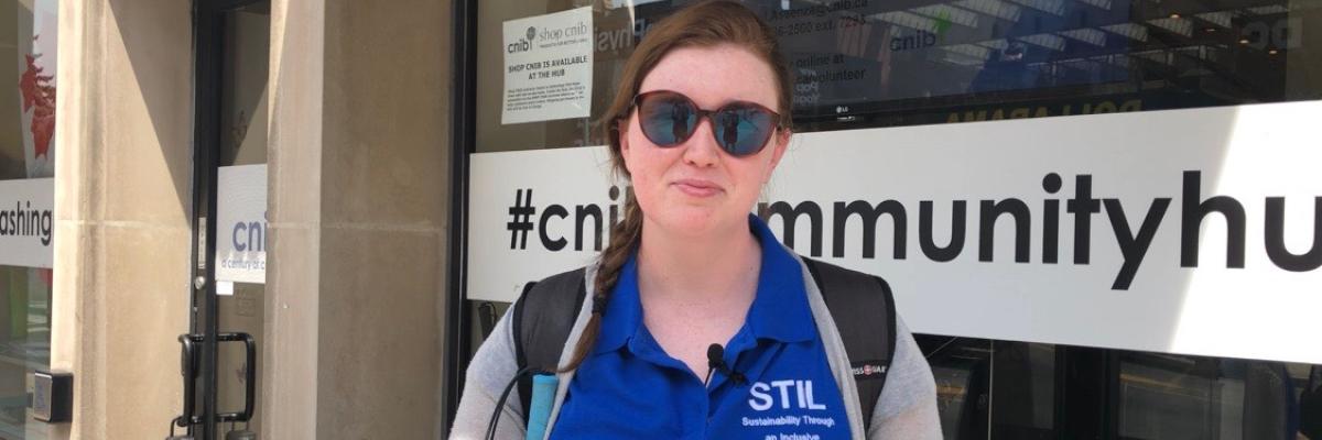 Young entrepreneur Hillary Scanlon stands in front of a CNIB hub.