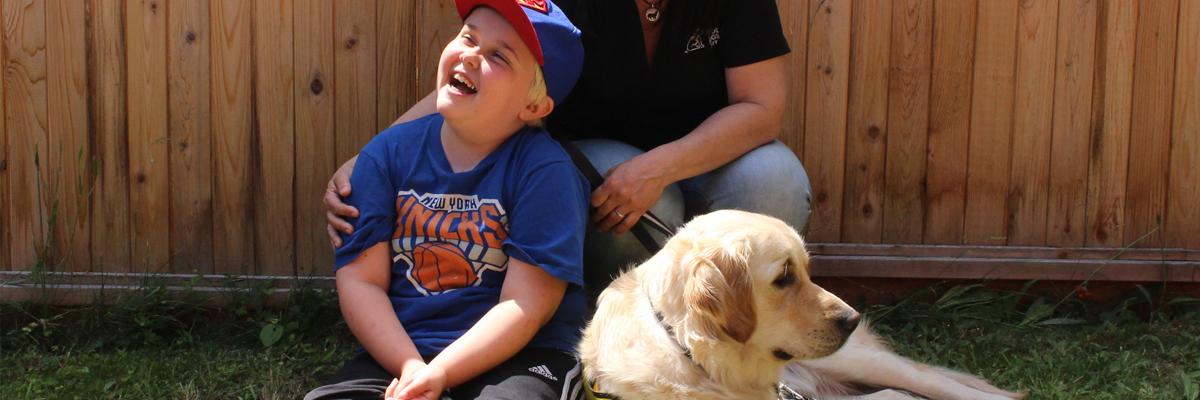 A young boy and a Golden Retriever.