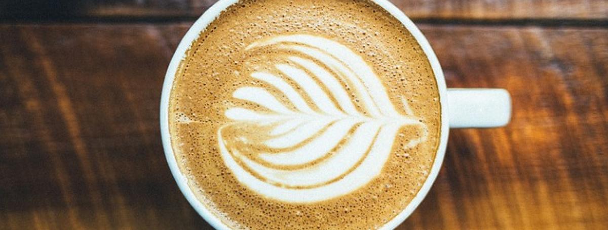 A coffee cup sits on a table.