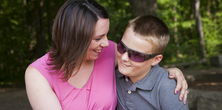 Boy and mother smiling 