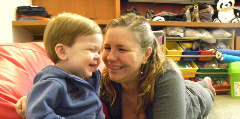 Boy and mother smiling 