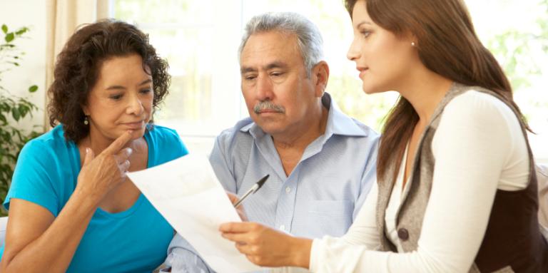 Couple consulting with their financial advisor