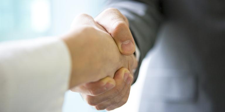 two people shaking hands