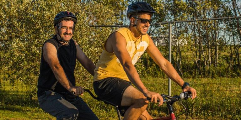 A CNIB volunteer and participant out for a spin on a tandem bike