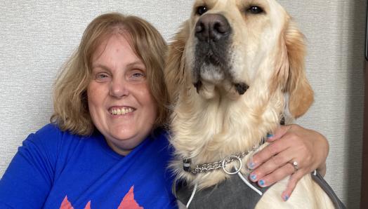 Chris Trudell-Conklin and her guide dog, Cody, a 2-year-old golden retriever.