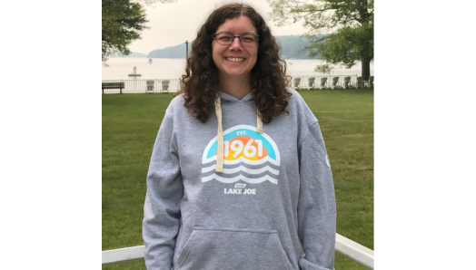 CNIB Lake Joe staff member wearing CNIB Lake Joe 60th anniversary hoodie