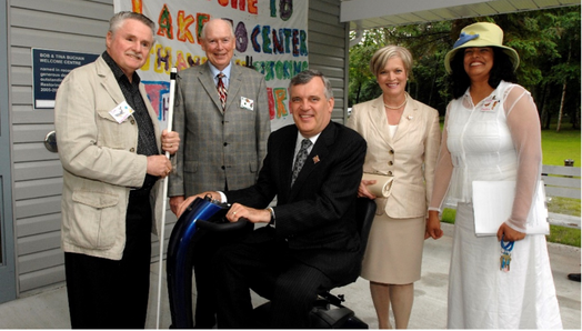 The Honourable David Onley joins former CNIB president Jim Sanders, former CNIB Board Chair Al Jaimeson, and other CNIB Staff for an event at our Lake Joe Camp in Muskoka, Ontario.